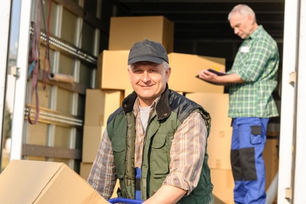 Delivery service mover man cardboard box